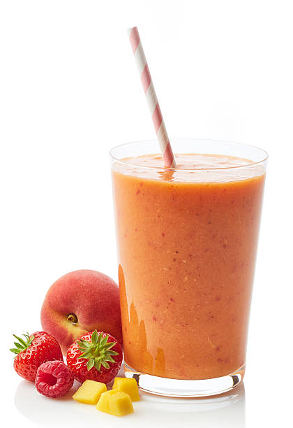 Glass of fruit and berry smoothie Glass of fresh healthy fruit and berry smoothie isolated on white background peach smoothie stock pictures, royalty-free photos & images