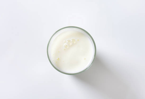 glass of milk glass of milk on white background drinking glass photos stock pictures, royalty-free photos & images