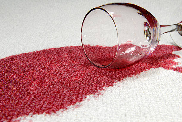 Glass of red wine spilt on carpet.  spilling stock pictures, royalty-free photos & images