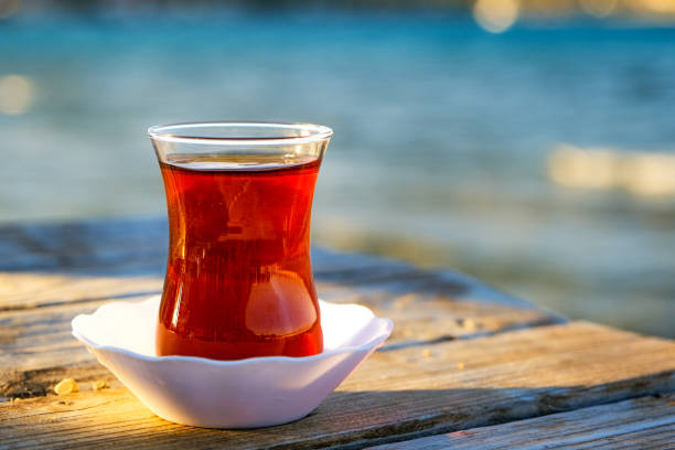 Glass of traditional Turkish tea at the seaside. stock photo