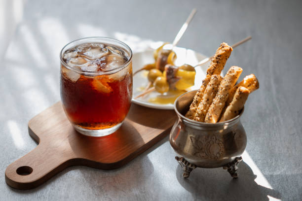 Glass of vermouth and snacks in Spain Glass of vermouth and snacks in Spain vermouth stock pictures, royalty-free photos & images