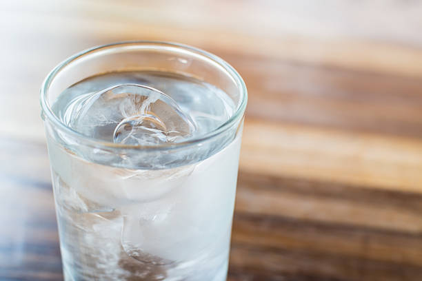 Glass with Ice Cold Water. stock photo