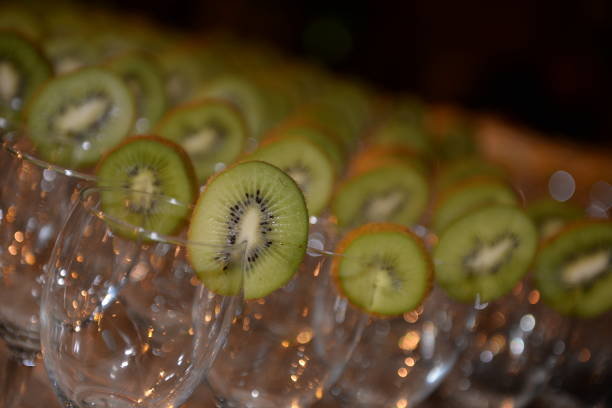 glasses for champagne with kiwi berries. stock photo