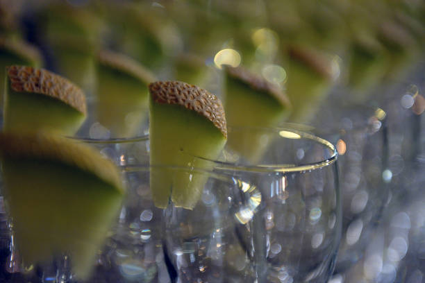 Glasses for champagne with melon berries. stock photo