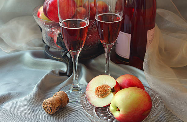 Glasses of champagne and nectarines.. stock photo