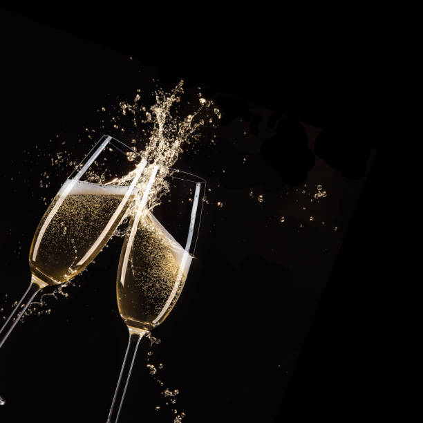 Glasses of champagne, celebration theme Glasses of champagne with splash, celebration theme. toasted bread stock pictures, royalty-free photos & images