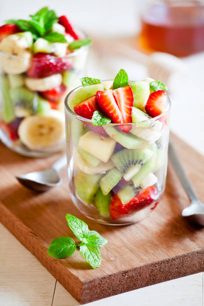 Glasses Of Fruit Salad Close up of some refreshing summer fruit salad fruit salad stock pictures, royalty-free photos & images