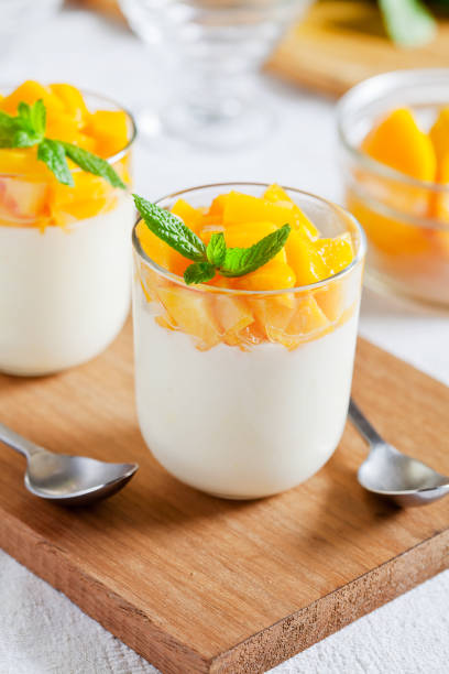 Glasses Of Yogurt With Poached Mango stock photo