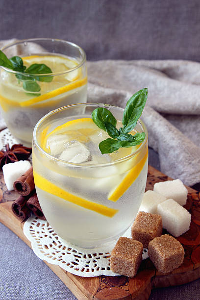 Glasses with cold lemonade and ice cubes.. stock photo