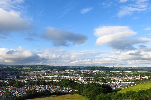 Glastonbury Festival panoramic sunny view from hillside blue sky stock photo