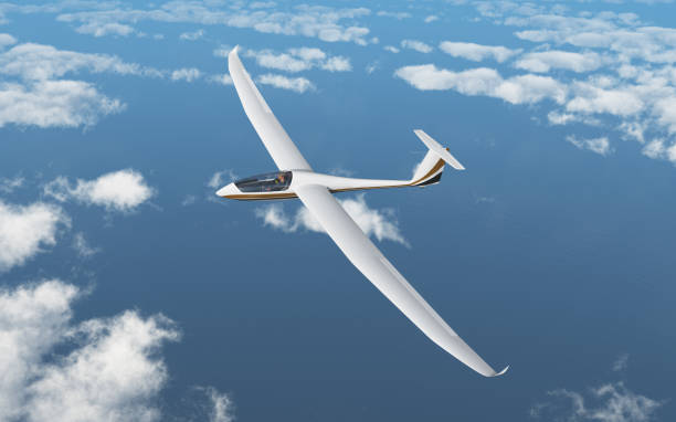 Glider over the clouds stock photo