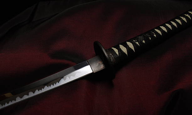 Glint 2 A samurai sword with light reflecting off its blade. bushido lifestyle stock pictures, royalty-free photos & images