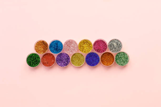 Glitter and sequins for makeup and nail design in transparent jars. stock photo