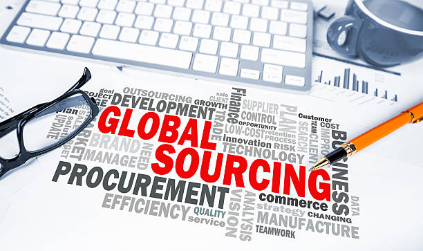 global sourcing word cloud on office scene stock photo