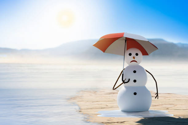 global warming concept funny snowman suffers climate change melting snow man stock pictures, royalty-free photos & images