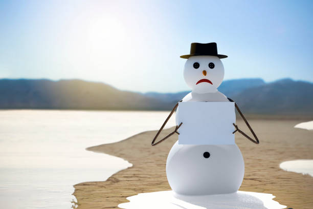 global warming concept snowman protest against climate change and global warming melting snow man stock pictures, royalty-free photos & images