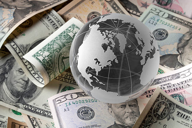Globe with dollar bills Globe with dollar bills.Some similar pictures from my portfolio: US DOLLAR stock pictures, royalty-free photos & images