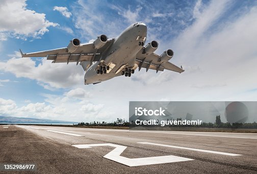 istock C-17 Globemaster Military Cargo Airplane Taking Off 1352986977
