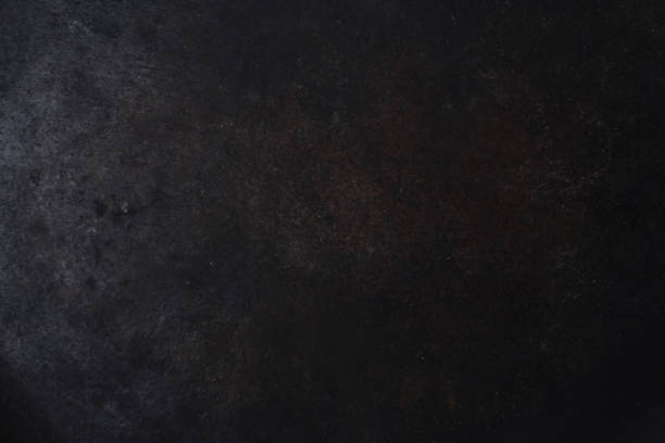 gloomy black painted metal surface. industrial background stock photo