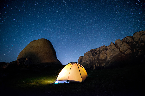 Glowing Camping Tent In The Mountains Under A Starry Sky Stock Photo ...