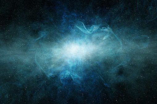 light glowing in a blue nebula in the starry field