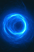 istock Glowing vortex of light flowing into a black hole 1303806063