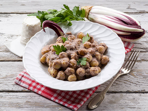 gnocchi with chicory and ricotta sauce stock photo
