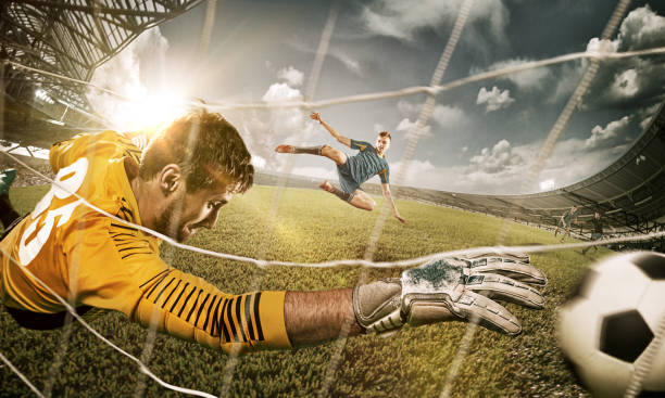 Goalkeeper in gates jumping to catching ball The soccer goalkeeper in gate jumping to catching ball. Collage. Advertising concept of soccer football soccer striker stock pictures, royalty-free photos & images