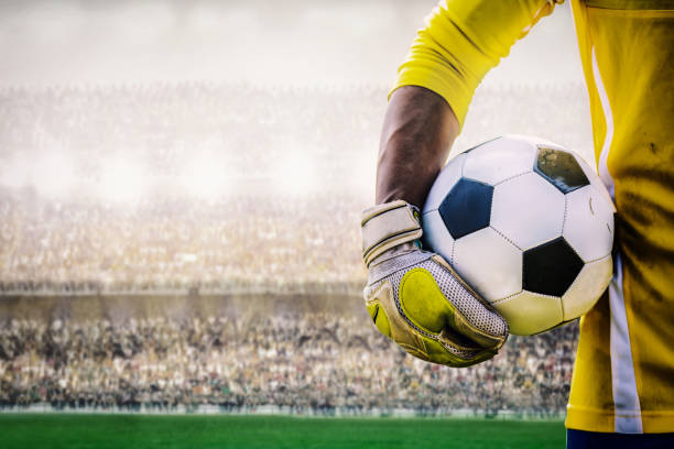 goalkeeper with a soccer ball in the stadium goalkeeper with a soccer ball in the stadium goalie stock pictures, royalty-free photos & images