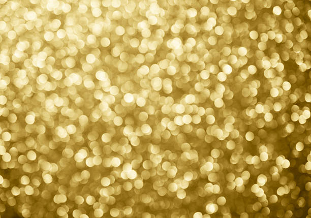 золото абстрактный фон bokeh круги для рождественского фона. - sparks стоковые фото и изображения