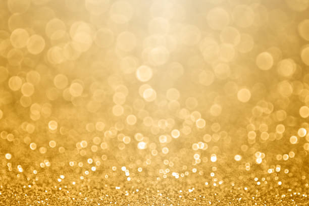 Gold celebration background for anniversary, New Year Eve, Christmas, falling coins, wedding or birthday stock photo