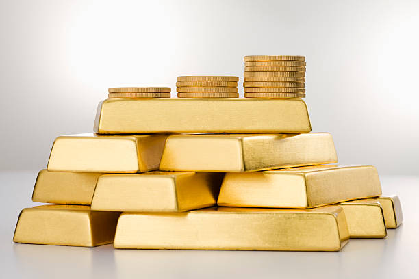 Gold Coins and Ingots.  gold bar stock pictures, royalty-free photos & images