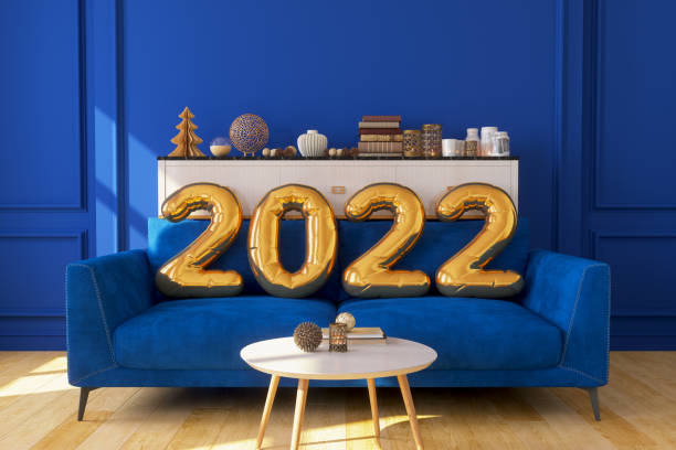 Gold Color 2022 Year Balloons On Blue Sofa