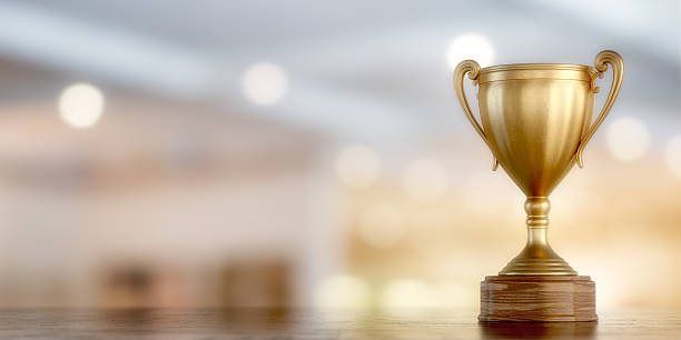 gold cup winner gold cup winner on bokeh background, 3D illustration award stock pictures, royalty-free photos & images