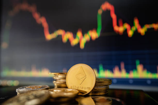 Gold Ethereum with candle stick graph chart and digital background Stack or heap of gold Ethereum cryptocurrency with candle stick graph chart and digital background. With Ethereum stock pictures, royalty-free photos & images