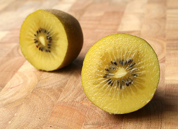 Gold Kiwifruit, cut in half stock photo