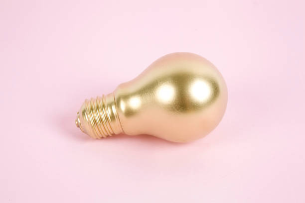 gold light bulb stock photo