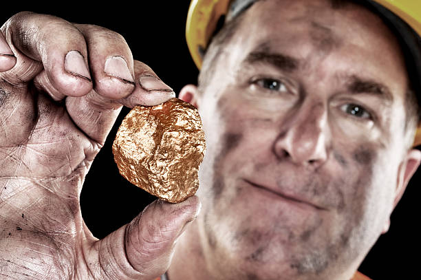 Gold miner with nugget stock photo