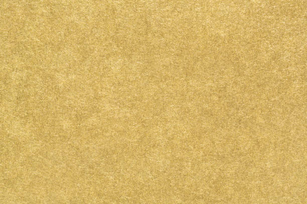 Gold paper texture or smooth matte golden foil background. Gold paper texture. Smooth matte golden foil abstract background. Close-up. matte finish stock pictures, royalty-free photos & images