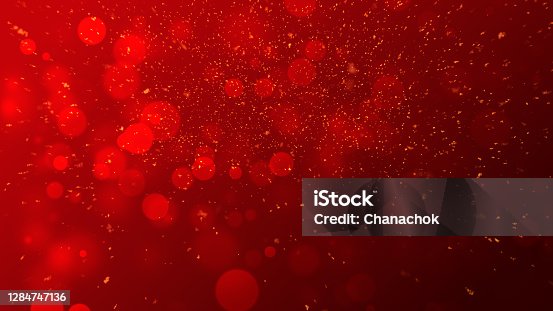 istock gold particles abstract background with shining golden Floating Dust Particles Flare Bokeh star on red Background. Futuristic glittering in space. 1284747136