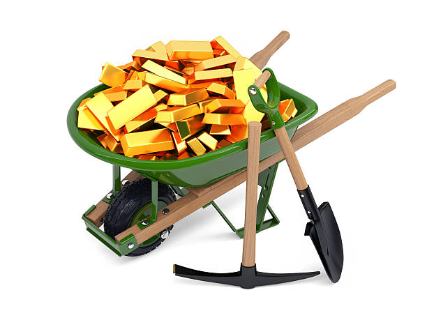 Gold Rush Three dimensional model of wheelbarrow loaded with gold, spade and pickaxe. Isolated on white. rich strike stock pictures, royalty-free photos & images