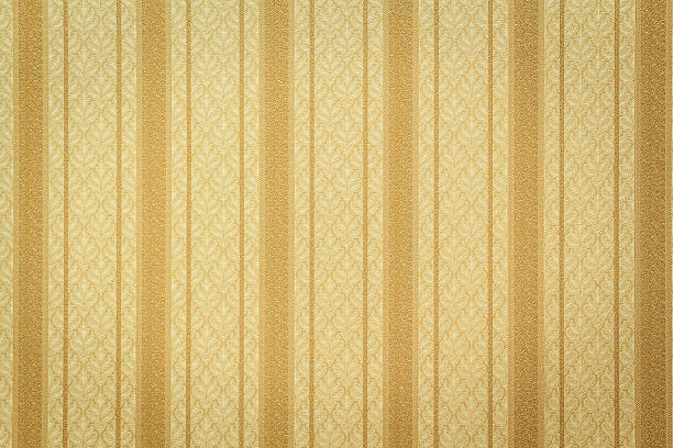 Gold striped wallpaper with floral pattern Antique style striped gold wallpaper 20th century style stock pictures, royalty-free photos & images