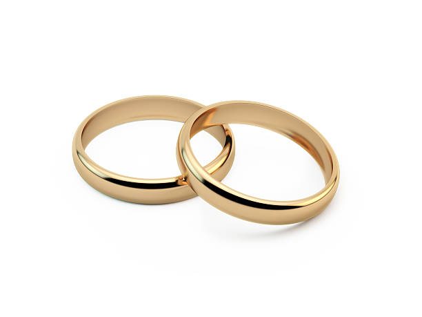 Gold Wedding Rings Gold wedding rings sitting on top of each other. Great use for wedding, love and romance concepts. Isolated on white background. Clipping path is included. wedding ring stock pictures, royalty-free photos & images
