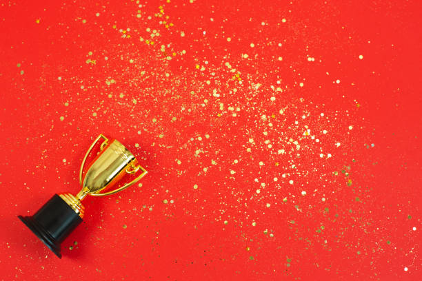 Gold Winner trophy with golden shiny stars stock photo