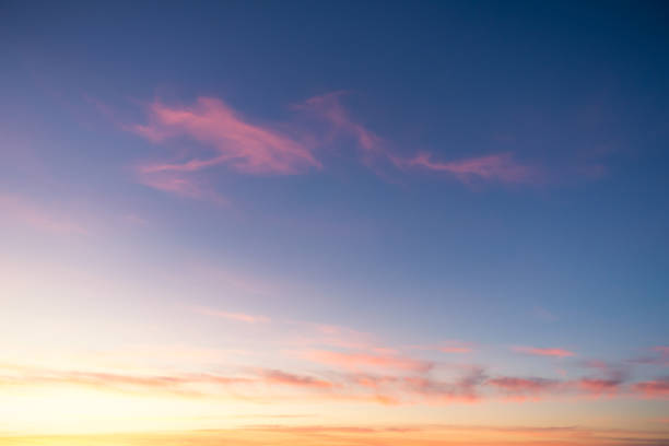 Golden and pink sunset horizon Wispy cirrus cloud above a golden sunset in Italy. sky only stock pictures, royalty-free photos & images