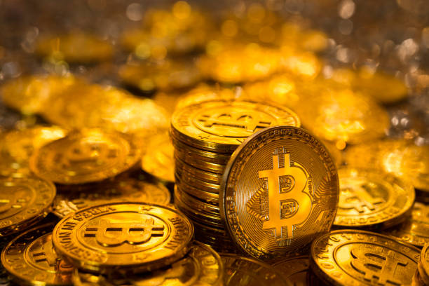 Golden bitcoins Izmir, Turkey - January 12, 2018: Bunch of memorial golden bitcoins. Bitcoin is a worldwide digital currency that isn't controlled by a central authority such as a government or bank. bitcoin and gold stock pictures, royalty-free photos & images