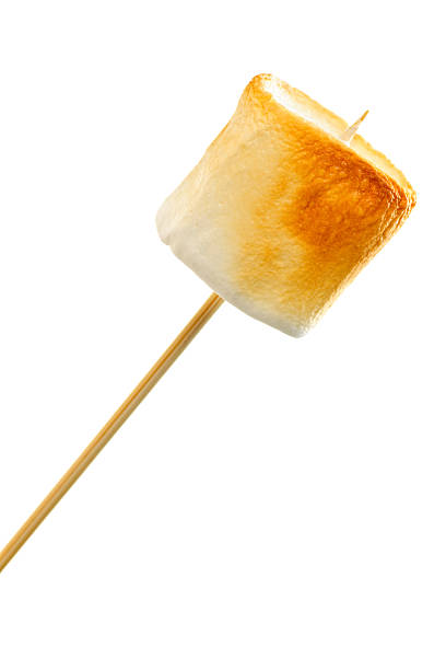 Golden brown toasted marshmallow Golden toasted marshmallow on a wooden skewer toasted food stock pictures, royalty-free photos & images