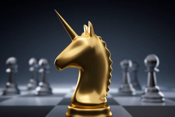 Golden chess piece unicorn stock photo