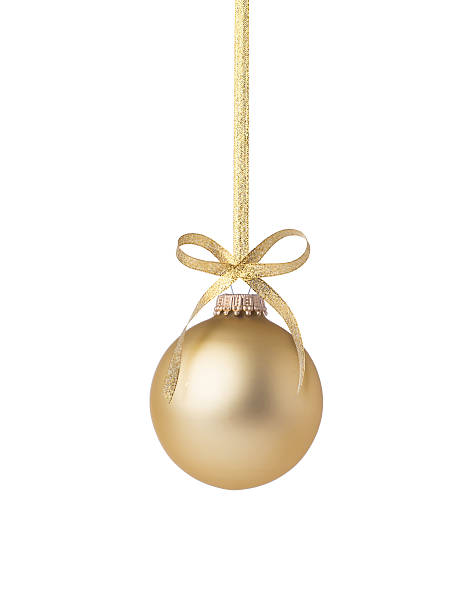 Golden Christmas Ball A perfect golden holiday ornament ganging on a gold metallic ribbon. Adorned with a perfectly tied golden bow and isolated on white. Gold Ornament stock pictures, royalty-free photos & images