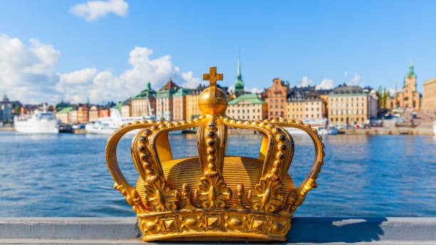 Golden crown on Skeppsholm bridge in Stockholm stock photo